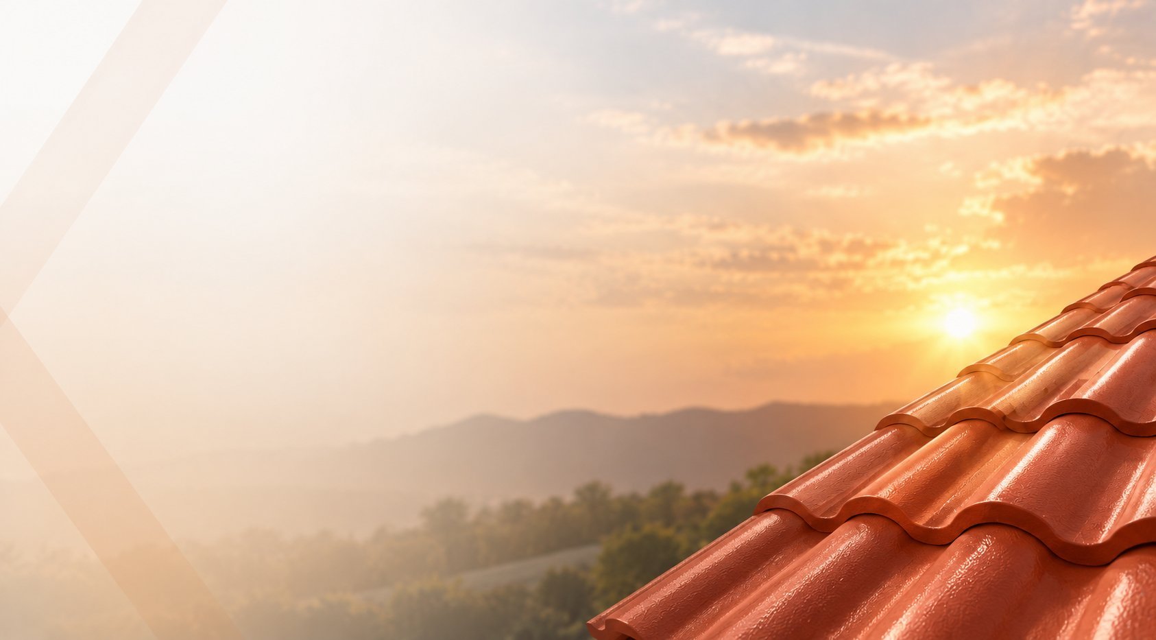 Red tiled roof edge with golden sunset over misty mountains in the background